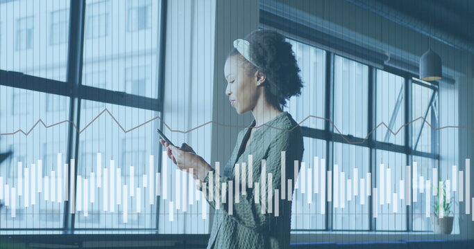 Image of data processing over african american businesswoman working in office