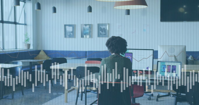 Image of data processing over african american businesswoman working in office