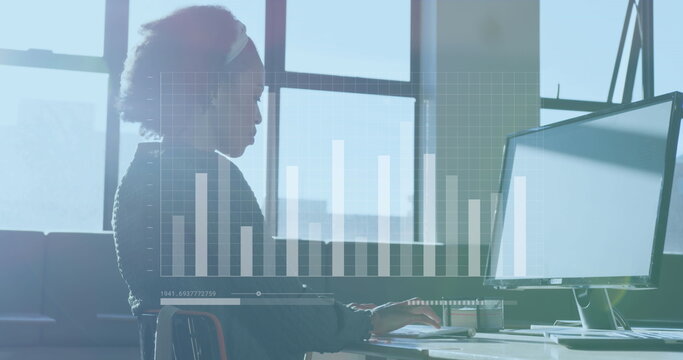 Image of data processing over african american businesswoman working at office