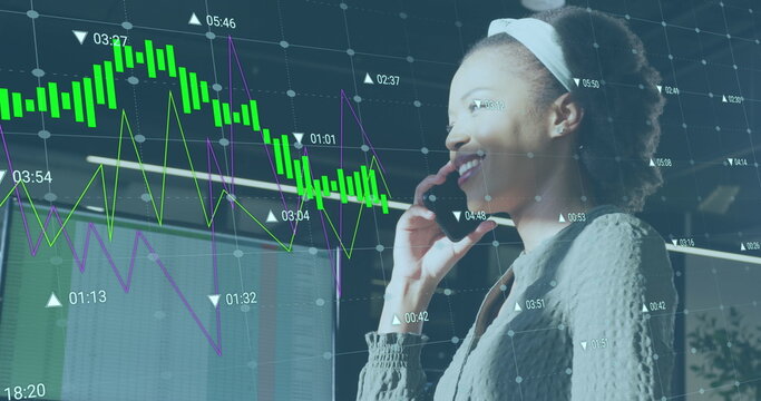 Image of data processing over african american businesswoman working at office