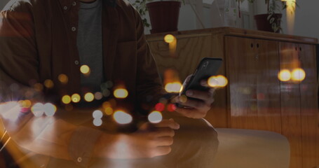 Image of cars on street over man using smartphone