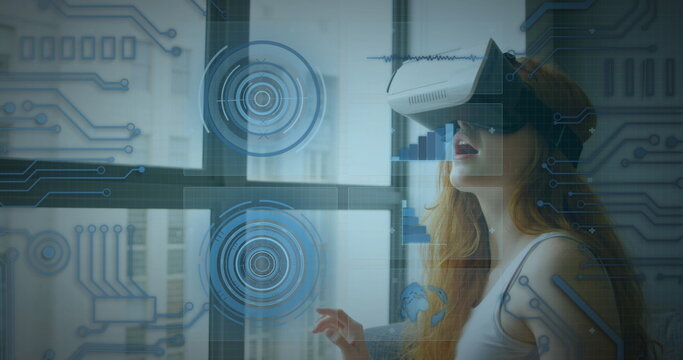 Image of scope scanning and data processing over woman wearing vr headset