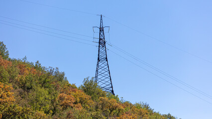 Metal electric pole in the mountains