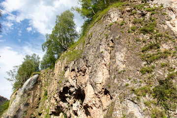 Waterfall on a rocky river in the mountains