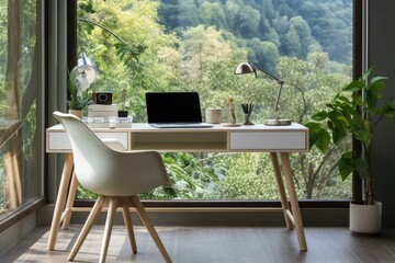 Fototapeta premium In a home office, a wooden desk placed in a corner is complemented by floor-to-ceiling windows, providing a refreshing summer green forest view for a nature-infused workspace.