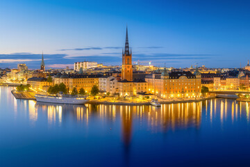 Fototapeta na wymiar Stockholm, Sweden. Panoramic view of the City centre. The capital of Sweden. Cityscape during the blue hour. View of the old town in Stockholm. Photo for background and wallpaper.