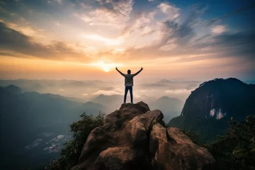  Successful hiker celebrates on mountain top - young mans outdoor lifestyle in forest pathway © sorin
