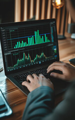 Fototapeta premium A person use laptop with stock charts displayed