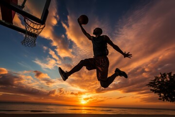 Sunset slam dunk - street basketball player training outdoors - sport competition concept