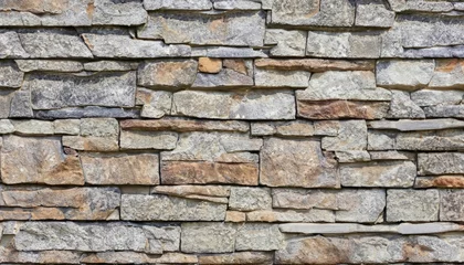 Foto op Canvas A seamless texture of rock walling material. A stone veneer that is applied to the walls of buildings © ROKA Creative