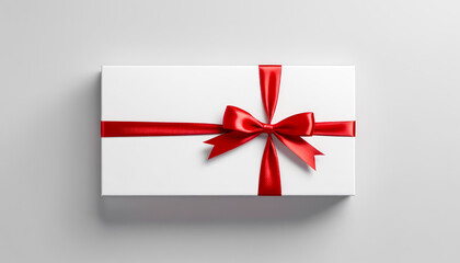 white gift box adorned with vibrant red ribbon tied in perfect bow, capturing essence of celebration and surprise. holidays, birthdays, anniversaries. top view