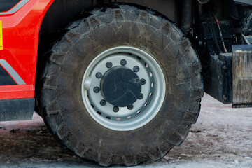 Heavy machinery construction truck big tyres in winter on construction yard