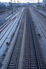 View of the railway tracks from the Donnersberger Bridge in Munich, Germany towards the main train station at dusk