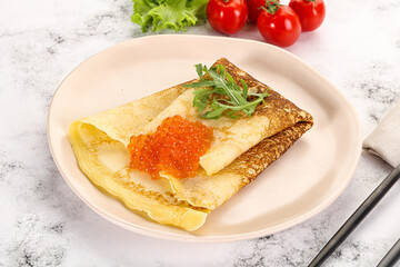 Russian pancake with red caviar