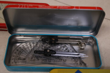 open Geometry box isolated on white background with compass, protractor set scale divider etc.,