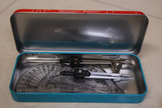 open Geometry box isolated on white background with compass, protractor set scale divider etc.,