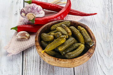 Marinated small cucumbers in the bowl