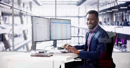 Data Analyst African Man Using Spreadsheet