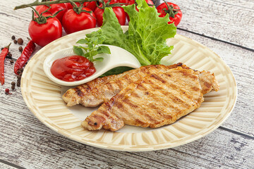 Grilled pork steak with ketchup