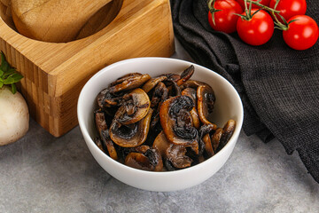 Roasted champignon mushrooms in the bowl
