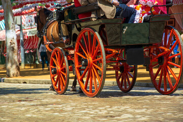 The ancient carriages walking for the Feria de April in Andalusia in Seville