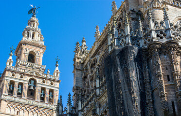 Fototapeta na wymiar the blue sky background on the Gothic Cathedral of Santa Maria in Seville Spain