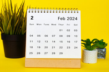 February 2024 calendar with yellow over background. Monthly calendar concept