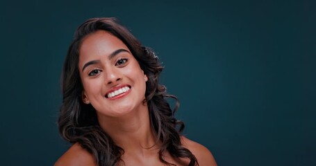 Brush, makeup and face of happy woman on blue background for wellness, skincare and cosmetics. Dermatology, spa and portrait of person with beauty for natural glow, salon and cosmetology in studio