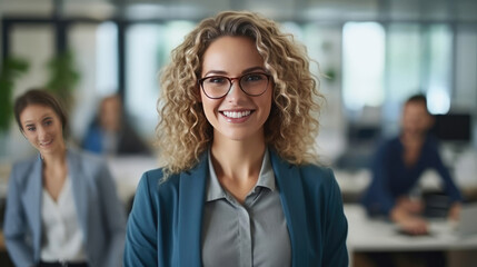 Attractive and confident smiling professional woman posing in her business office with her colleagues
