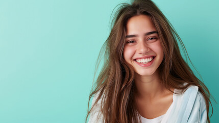 Naklejka premium Smiling happy attractive young woman posing in studio shot