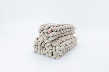 Bundles of rope incense made of mixtures of Himalayan herbs shot on white background