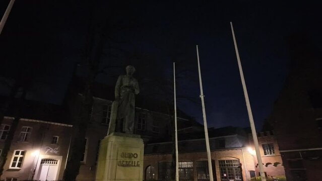 Statue in the city of Bruges in Belgium near the Lieve vrouwe Kathedraal in the early hours of the morning.