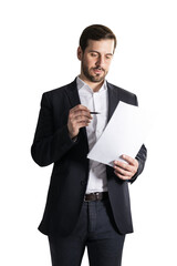 Analytical businessman reviewing document, deep in thought, isolated on white