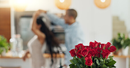 Roses, valentines day and home with couple dancing for love celebration in a kitchen with waltz....