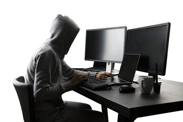 Hooded figure operating computer, dark theme suggesting cybersecurity or hacking activity