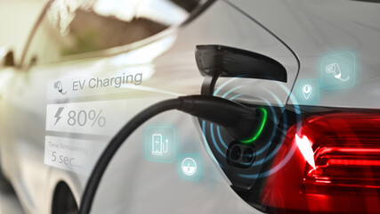 Electric vehicle being charged with futuristic display charger status. Eco friendly sustainable...