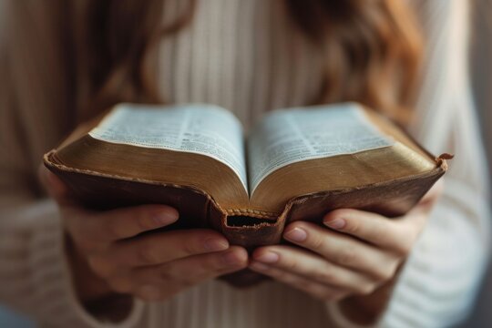 Close-up of woman opening bible in hand The concept of peace and solitude