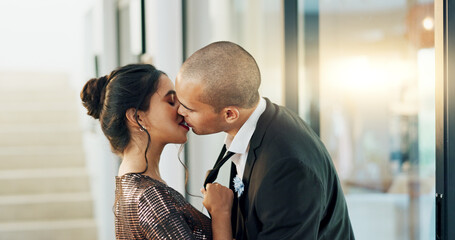 Couple, love and kiss with passion on a date for formal event, intimacy and romance on valentines...