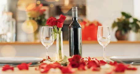 Fotobehang Eetkamer Wine, flowers and romance on valentines day for celebration of love, anniversary or honeymoon in still life. Glass, dinner and elegant date in dining room of home for event, milestone or occasion  © Felix/peopleimages.com