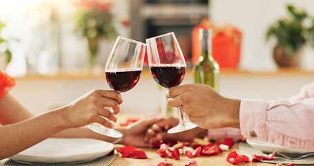 Couple, hands and toast with wine glass for home celebration of love, romance and valentines day on...