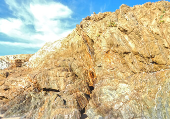 Colorful slate natural rocks at the beach of Vila Nova de Milfontes in Portugal