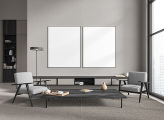 Gray living room with armchairs and posters