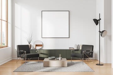 White living room interior with armchairs and poster
