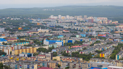 Fototapeta na wymiar Top view of the cityscape. Residential urban areas. Aerial view of the buildings and streets of the city. Urban landscape. City of Petropavlovsk-Kamchatsky, Kamchatka Territory, Far East of Russia.