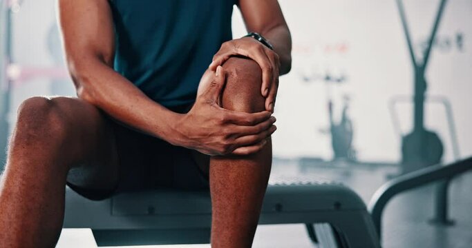 Gym, knee pain and man with fitness, leg injury and sports with athlete orthopedic problem and fibromyalgia emergency. African person, muscle tension or medical arthritis with training at health club