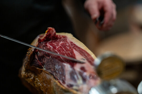 the hands of a pata negra Iberian ham cutter