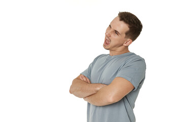 Fototapeta premium portrait of young happy man winking looking at the camera on white background