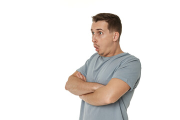 Obraz premium surprised guy looking at camera on white studio background