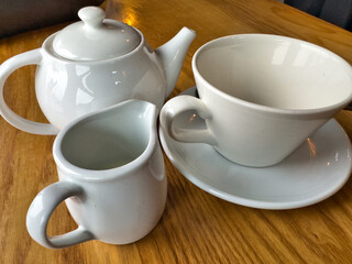 Tea pot and cup on a table