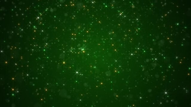 Irish colors background with shiny glittering green, white and gold stars and particles. Glitzy elegant celebration party animation. Abstract luxury Saint Patrick's Day background.